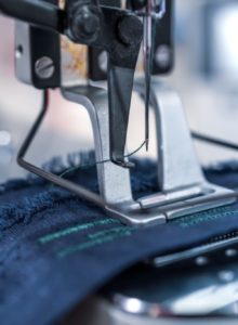 Professional sewing machine close-up. Modern textile industry.